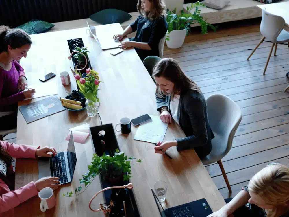 Coworkers focused on their tasks in a creative office environment.