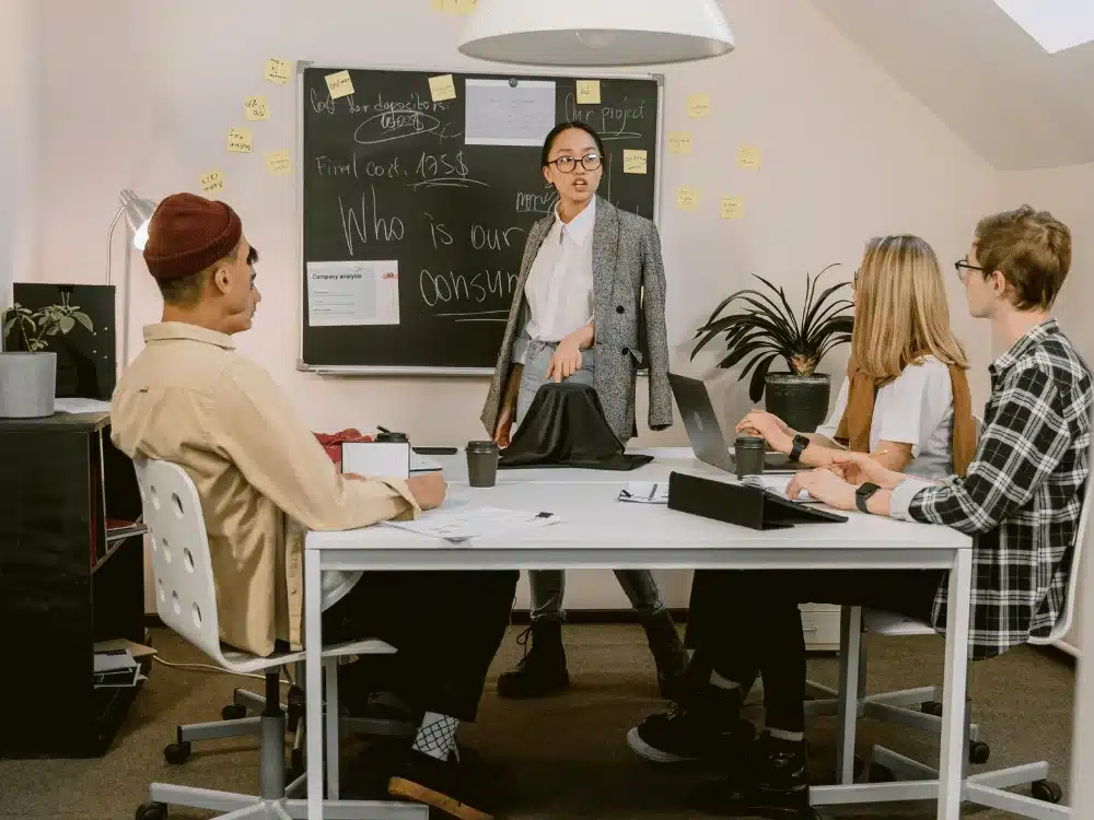 Office team discussing consumer insights during a brainstorming session.