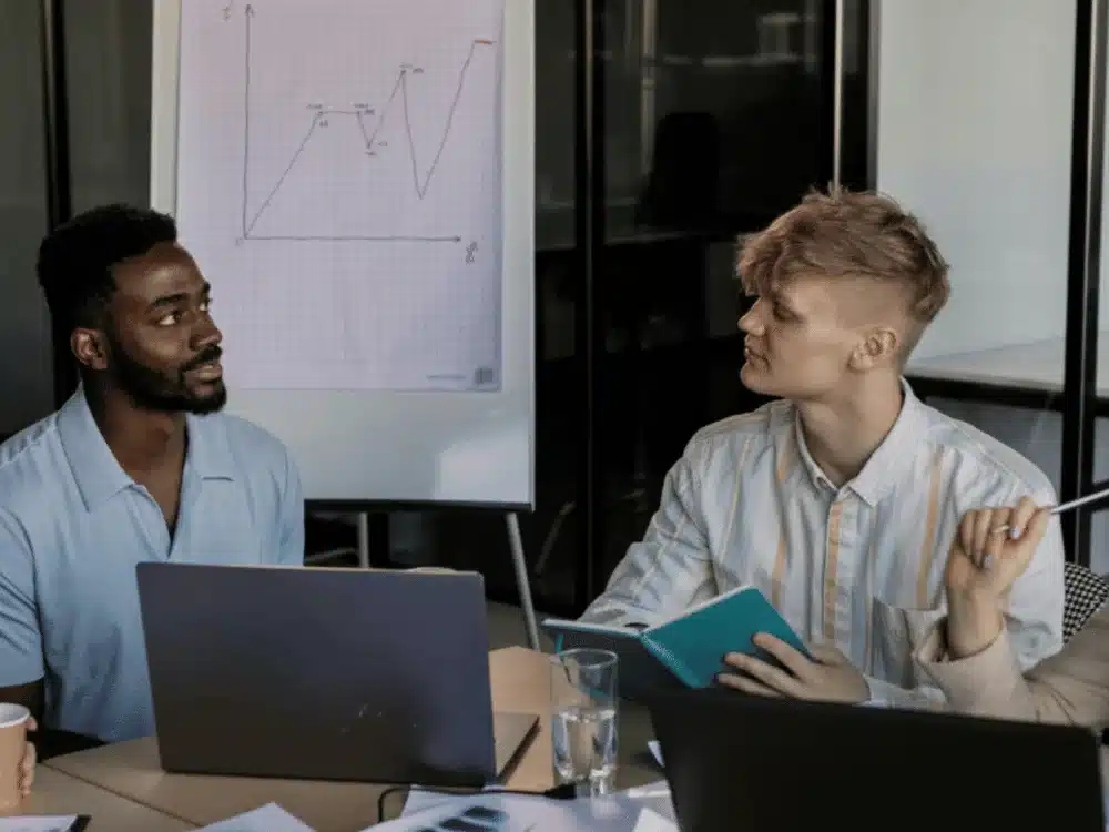 Confident presenter discussing a survey of global consumption using a graph.