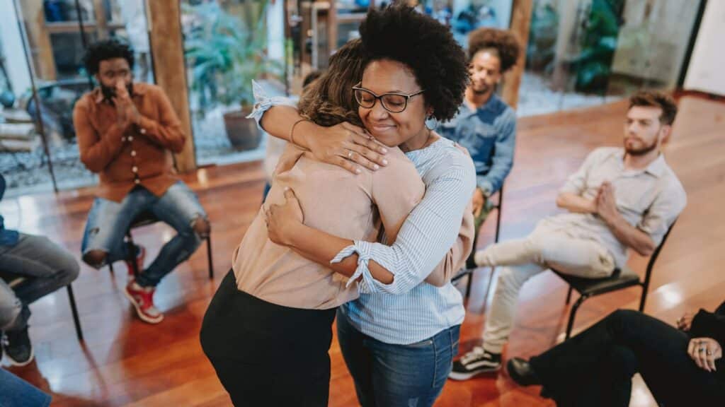 Two ladies embracing showing emotional intellogence and support