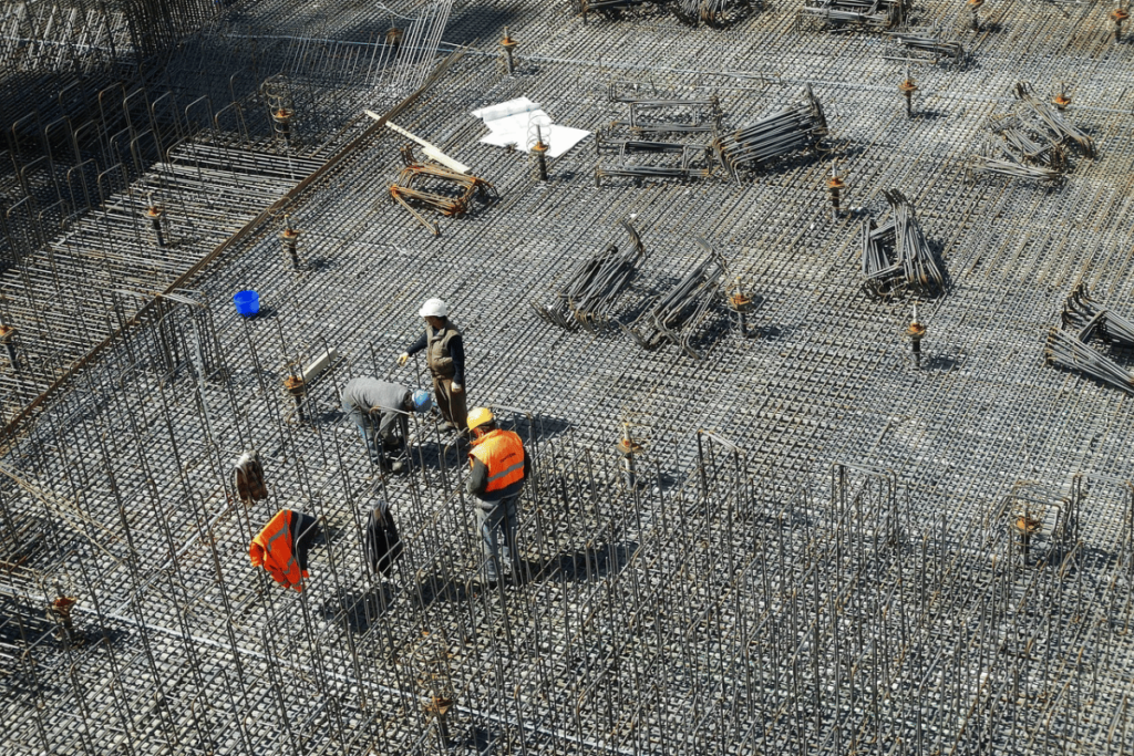 A group of construction workers working on a construction site.