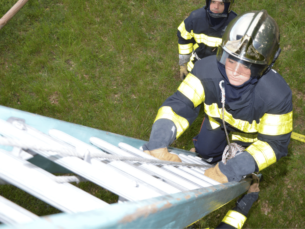 Emergency response team conducts ladder drill in training exercise.