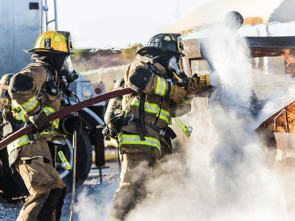 Firefighters extinguishing a blaze during a firefighting operation.