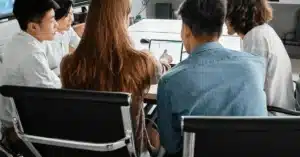 Group of young professionals having a meeting in a modern office setting.