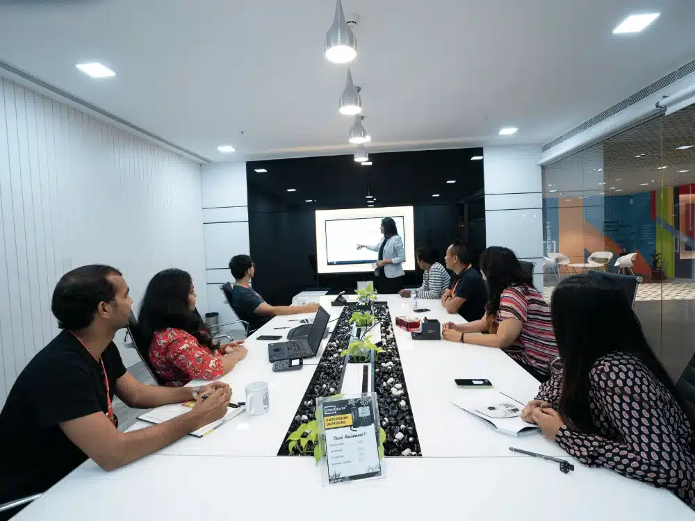 Team attending a business presentation in a conference room.